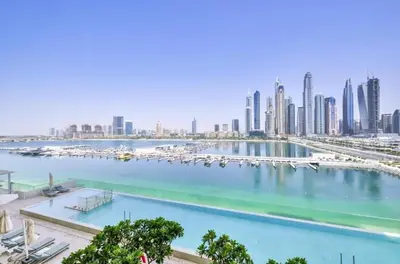a view of a city with a harbor with boats at Elegant 1BR Apartment with Free Beach Access in Dubai