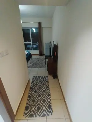 a room with a hallway with a rug on the floor at luxury master room available in sulafa tower marina in Dubai