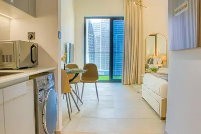 a kitchen and living room in a apartment at Dubai Skyline Retreat with Burj Khalifa View in Dubai