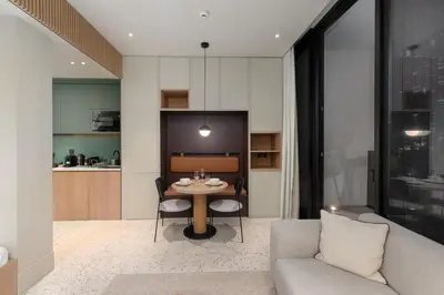 a living room with a table and a couch at Upside Living, Business Bay Dubai - Mint Stay in Dubai