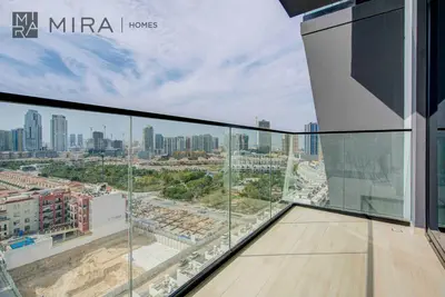a view of the city from the balcony of a building at Mira Holiday Homes - Lovely serviced apartment with pool access in Dubai