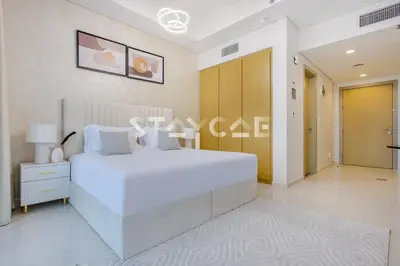 a large white bedroom with a large white bed at Aykon City Staycae Holiday Homes, Business Bay, Sheikh Zayed Road in Dubai