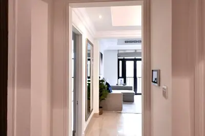 a hallway with a hallway leading to a living room at Lux Souk al Bahar Downtown Dubai 1 bedroom flat - Steps to Dubai Mall in Dubai