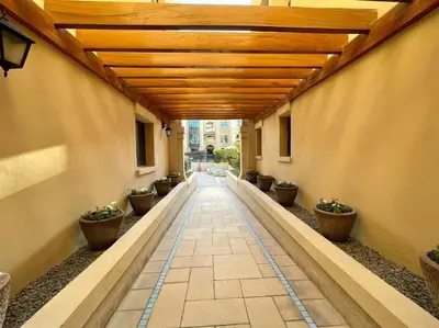 a hallway with potted plants on the side of a building at Lux Souk al Bahar Downtown Dubai 1 bedroom flat - Steps to Dubai Mall in Dubai