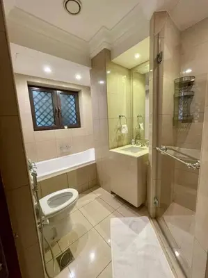 a bathroom with a toilet and a sink at Lux Souk al Bahar Downtown Dubai 1 bedroom flat - Steps to Dubai Mall in Dubai