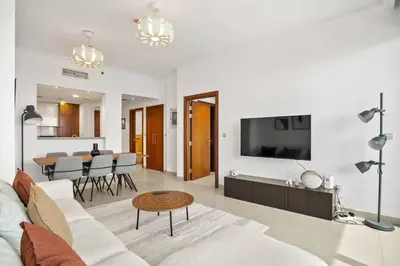 a living room with a couch and a table at Khalifa Views & Direct Mall Access in Burj Vista in Dubai