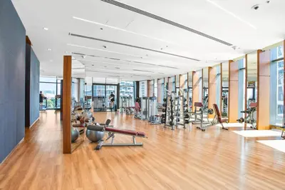 a gym with treadmills and exercise equipment in a building at Khalifa Views & Direct Mall Access in Burj Vista in Dubai