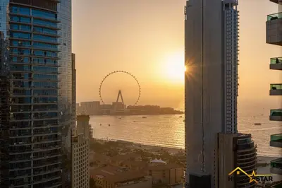 a view of the emirates wheel from the dubai city skyline at Marina & Beach Views, Pool, Art Haven! Near Cafes in Dubai