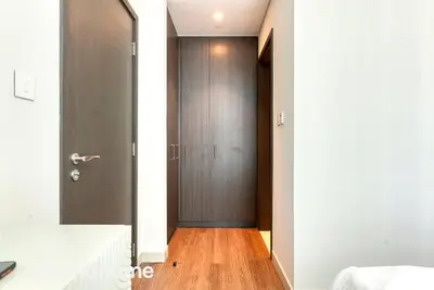 a hallway with a door leading to a bedroom at 2ndHome - Downtown Views 1 - Downtown Dubai in Dubai