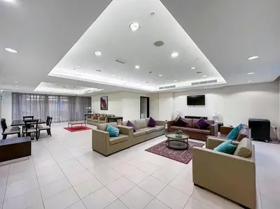 a large living room with couches and a table at FIRST CLASS 2BR Incredible Burj Khalifa View in Dubai