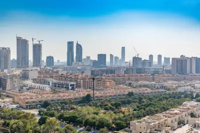 an aerial view of a city with tall buildings at Every Sunset is a Masterpiece in Catch Residence in Dubai