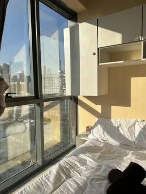 a bedroom with a bed and a large window at Hostel with Private Room near Downtown Business Bay in Dubai