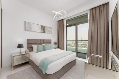 a bedroom with a large bed and a large window at Maison Privee - Exclusive Apt w/ Unmatched Dubai Marina Vistas in Dubai