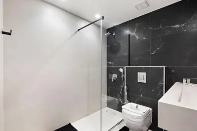 a bathroom with a toilet and a sink and a shower at Amazing 1br located in the heart of Dubai,JLT in Dubai