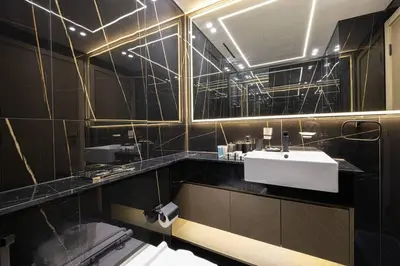 a bathroom with a sink and a mirror at Fully Furnished Luxe 1BR In JVC in Dubai