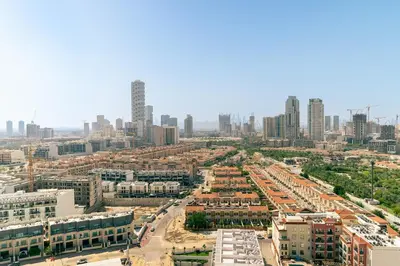 an aerial view of a city with tall buildings at CitiHome - 1BR Freshly Styled and Comfortable in JVC in Dubai
