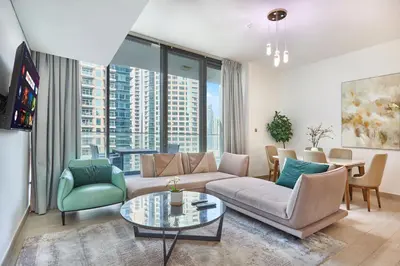 a living room with a couch and a table at Luxury Living in Marina Liv Residence 2BR in Dubai