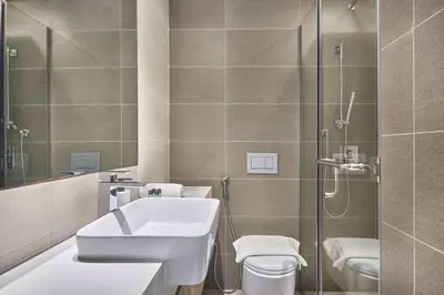 a bathroom with a sink and a shower at Luxury Living in Marina Liv Residence 2BR in Dubai