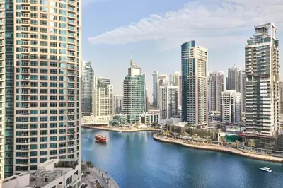 a view of a river in a city with tall buildings at Luxury Living in Marina Liv Residence 2BR in Dubai
