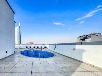 a swimming pool on the roof of a building at GuestReady - Luxury haven in JLT in Dubai