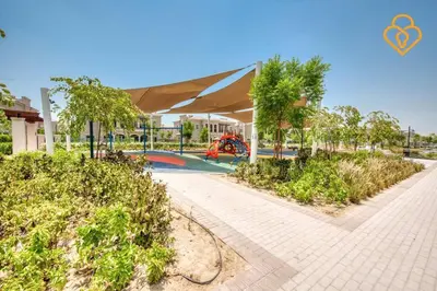a resort with a swimming pool and a building at Keysplease Beautiful 3 B/R Villa With Garden, Serena in Dubai
