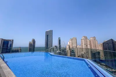 a large swimming pool on the roof of a building at Clever Guest 021 Condor Marina Star in Dubai
