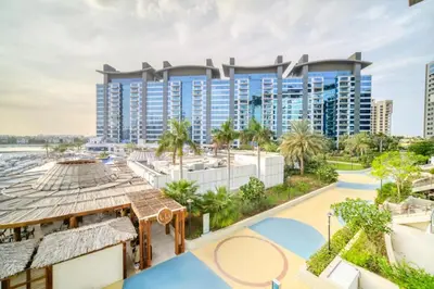 an aerial view of a resort with a pool and buildings at Oceana Luxury 4 BR Apartment with Resort Access and Sea Views by Exclusive Holiday Homes in Dubai