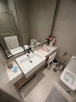 a bathroom with a sink and a toilet at Luxury Studio Brand New with HighEnd Furnishings in Dubai