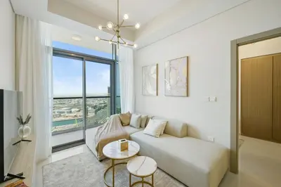 a living room with a couch and a large window at 35th Floor Luxury 2 BR with Stunning Views in Dubai
