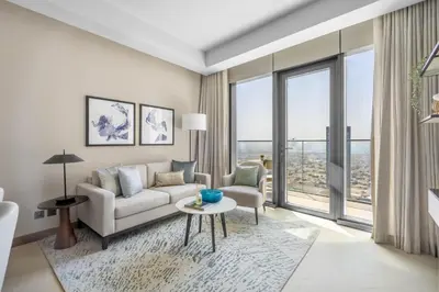 a living room with a couch and a table at GuestReady - Glamorous place near Burj Khalifa in Dubai