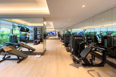 a gym with treadmills and cardio equipment in a building at GuestReady - Glamorous place near Burj Khalifa in Dubai