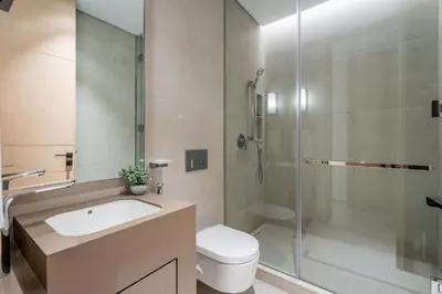 a bathroom with a toilet and a sink and a shower at GuestReady - Above the clouds in Dubai Marina in Dubai
