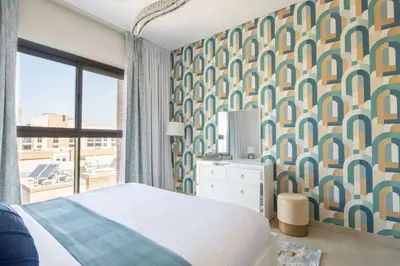 a bedroom with a bed and a large window at Frank Porter - Eleganz by Danube in Dubai