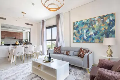 a living room with a couch and a table at Frank Porter - Eleganz by Danube in Dubai