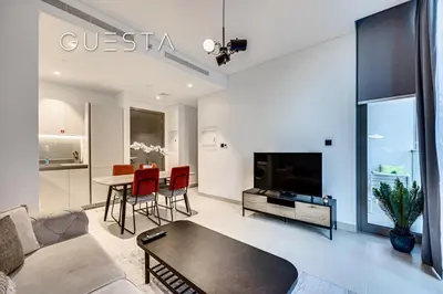 a living room with a couch and a table at Sobha Creek Vistas, Sobha Hartland, MBR City, Dubai in Dubai