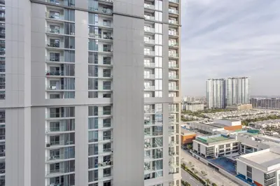 an aerial view of a tall white building at STAY BY LATINEM Luxury 1BR Holiday Home CV A1507 near Burj Khalifa in Dubai