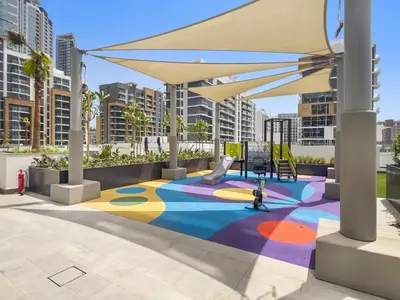 a playground with a colorful carpet in a city at StoneTree - Azizi Riviera 36 Studio - Brand new in Dubai