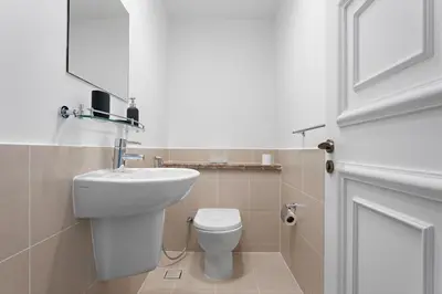 a bathroom with a white toilet and a sink at Stonetree - Golden Mile 4 - Beach Access in Dubai
