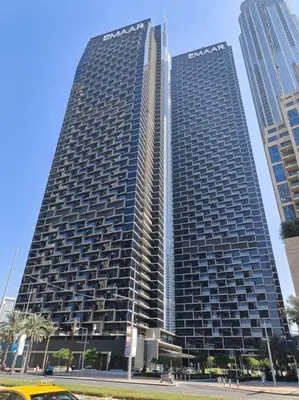 two tall skyscrapers in a city with buildings at Luxury of 1 minute walk to Burj Khalifa & D/Opera in Dubai