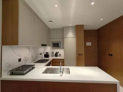 a kitchen with a sink and a counter top at Luxury of 1 minute walk to Burj Khalifa & D/Opera in Dubai