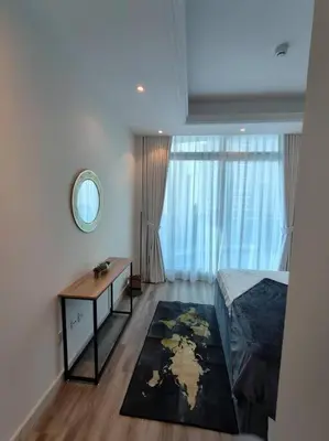 a bedroom with a bed and a desk and a mirror at Waterfront Marina Best View Amazing Location 2 Bed in Dubai