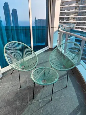 two chairs and a table on a balcony at Waterfront Marina Best View Amazing Location 2 Bed in Dubai