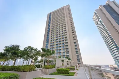 a tall building with two tall buildings at Silkhaus Chic 1BDR in Exclusive Neighbourhood in Dubai
