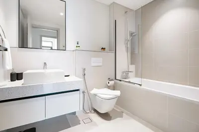 a bathroom with a sink and a toilet and a shower at Silkhaus Skyline View | Exclusive Neighbourhood in Dubai