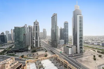 an aerial view of a city with tall buildings at Silkhaus Chic 1 BDR In a New Tower In Downtown in Dubai