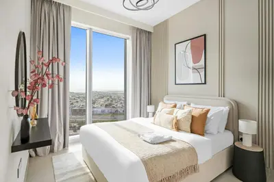 a bedroom with a large bed and a large window at Silkhaus Chic 1 BDR In a New Tower In Downtown in Dubai
