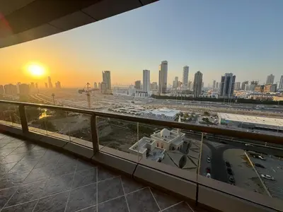 a view of a city skyline from a building at Stay in brand new Luxury Sport City apartment 15 in Dubai