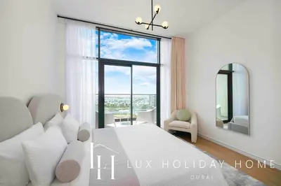 a bedroom with a bed and a large window at LUX The Dubai Hills Executive Suite in Dubai