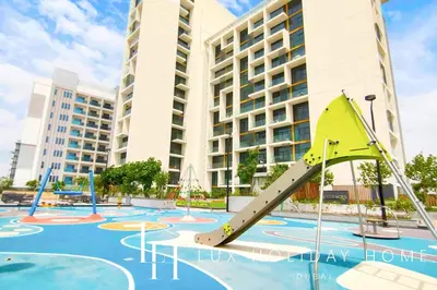 an image of a playground in front of a building at LUX The Dubai Hills Executive Suite in Dubai
