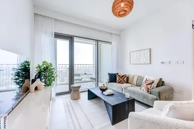 a living room with a couch and a table at Silkhaus High Floor 1 BDR In The Heart of Downtown in Dubai